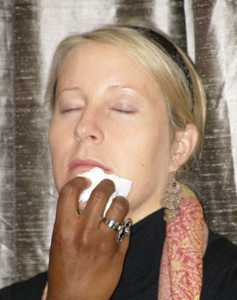 Bobbi Brown artists prepare the model's face for makeup application.